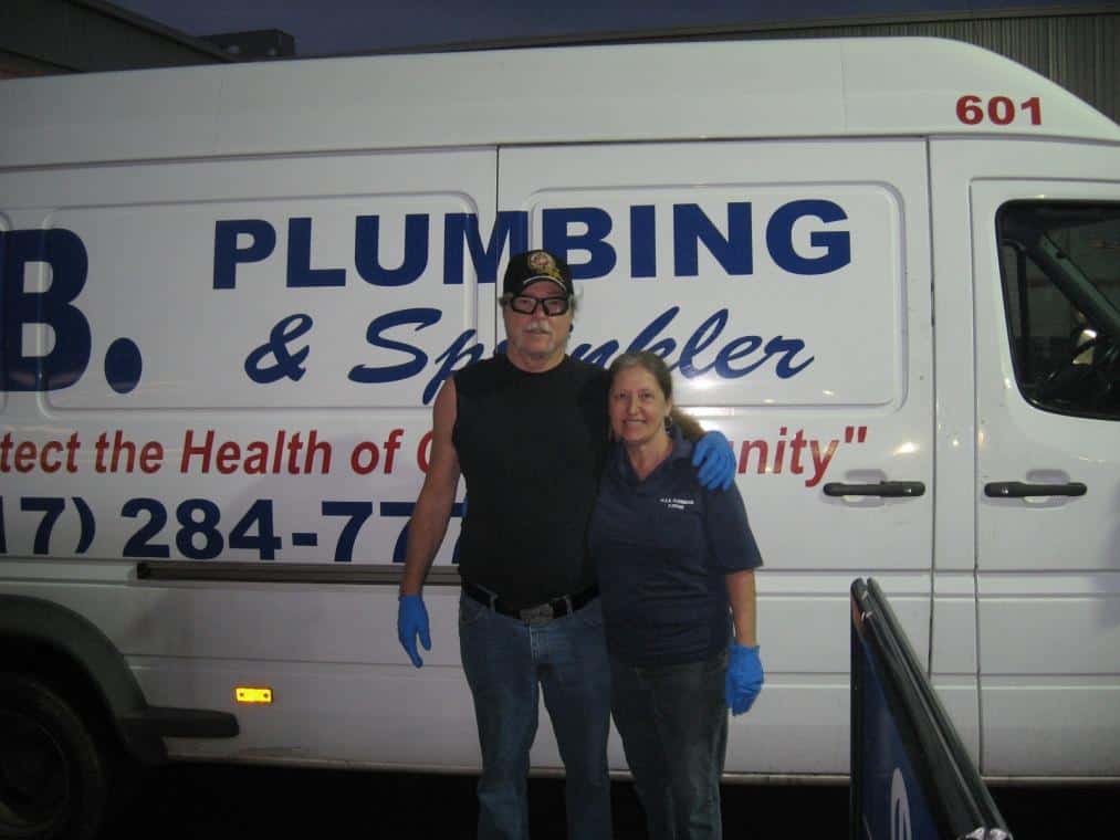 Fred and Kathlyn Smith together in front of one of their trucks