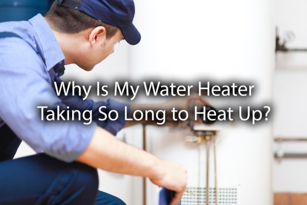 A plumber looking at a water heater with the words, why is my water heater taking so long to heat up?