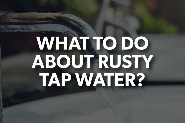 A picture of a sink faucet with the words, "what to do about rusty tap water."
