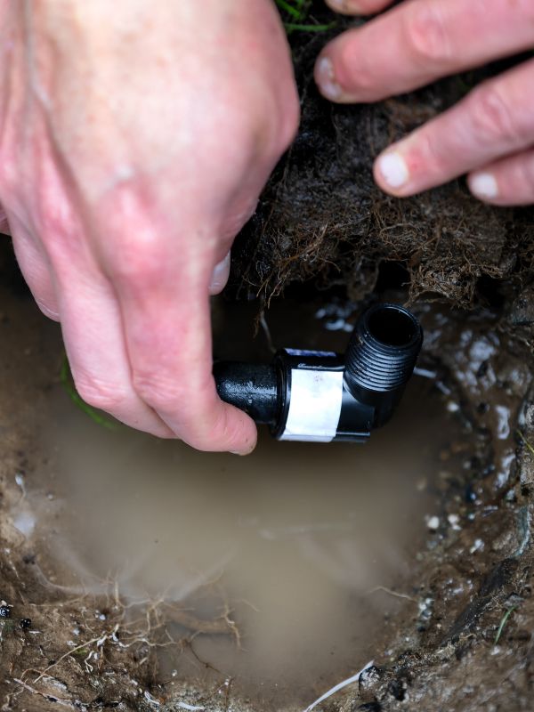 A sprinkler system is worked on.