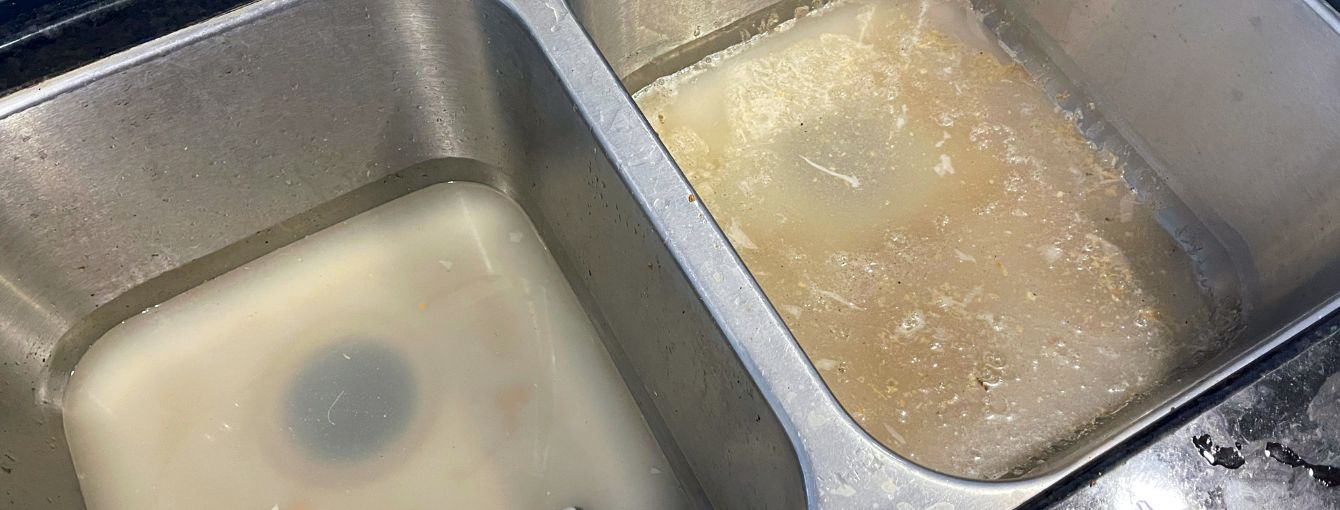 Clogged double kitchen sink