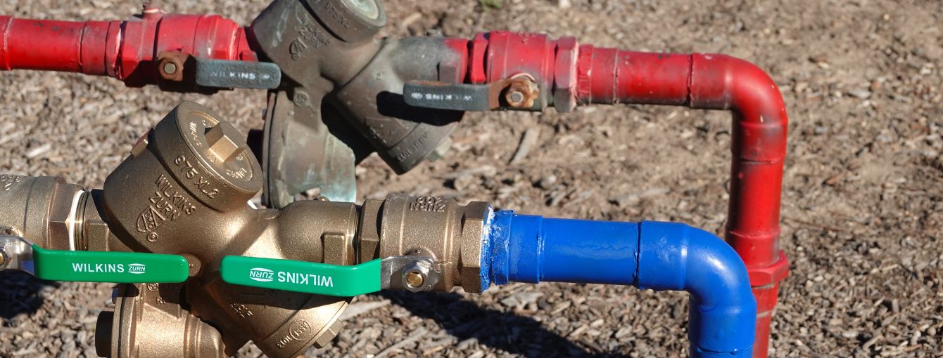 A closeup look at a backflow prevention device.